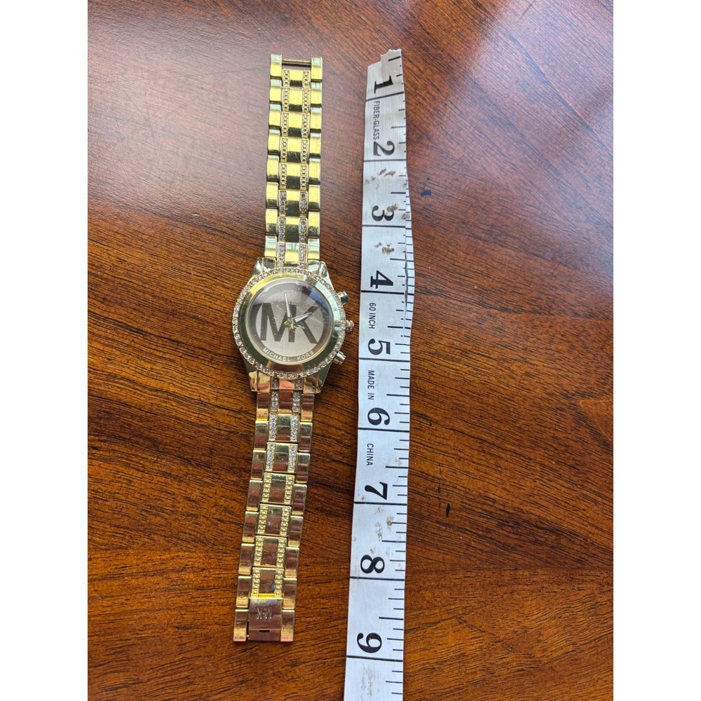 Michael Kors Ladies' Gold-Tone Stainless Steel Crystal-Accented Watch - Picture 6 of 7